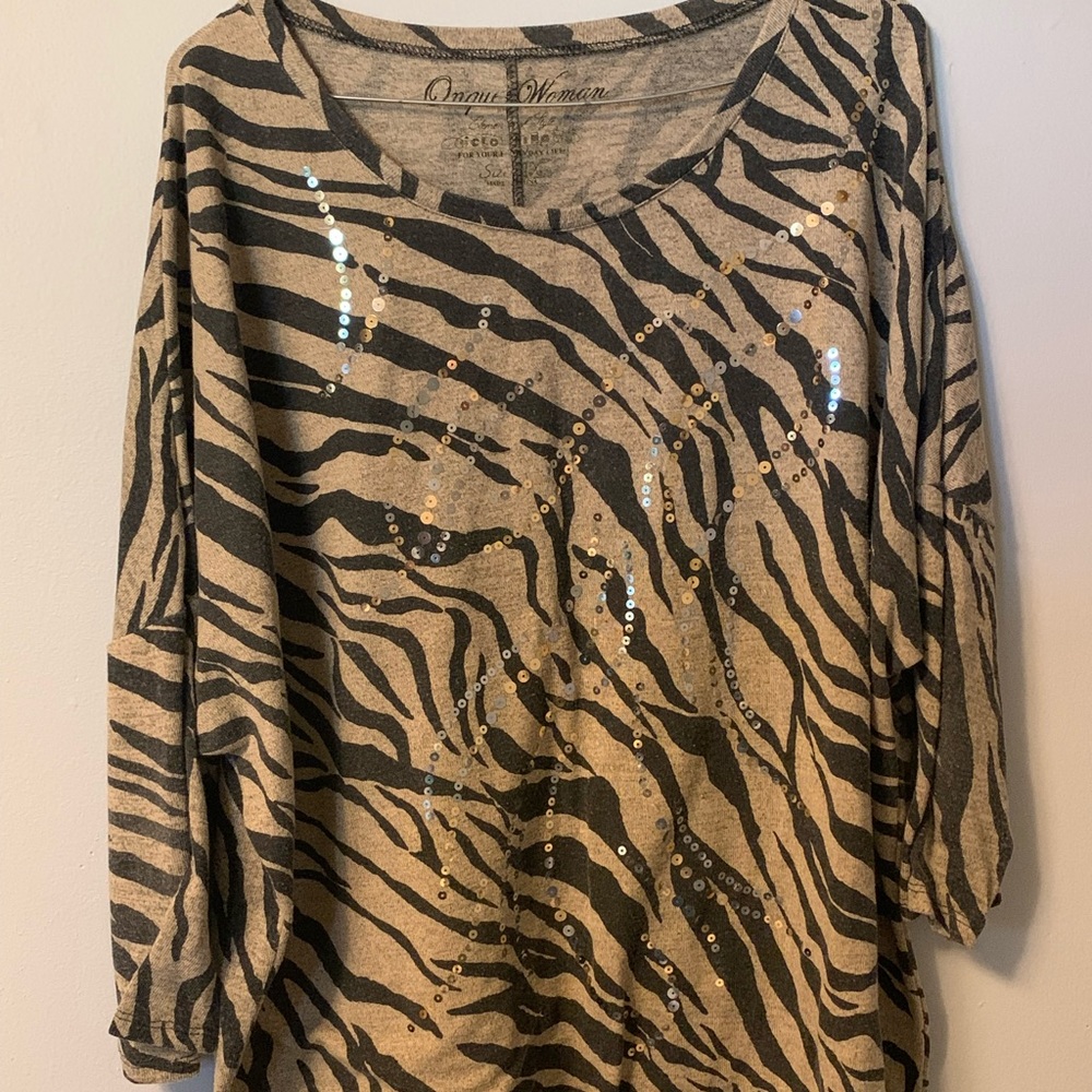This is a Onque Womens shirt.